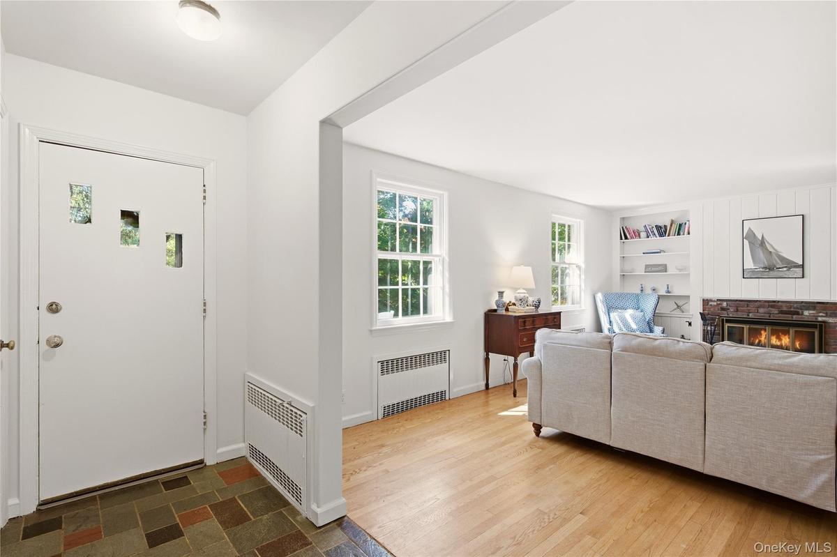 Foyer has coat closet and leads to living room