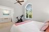 with walk in closet that has custom organizer system