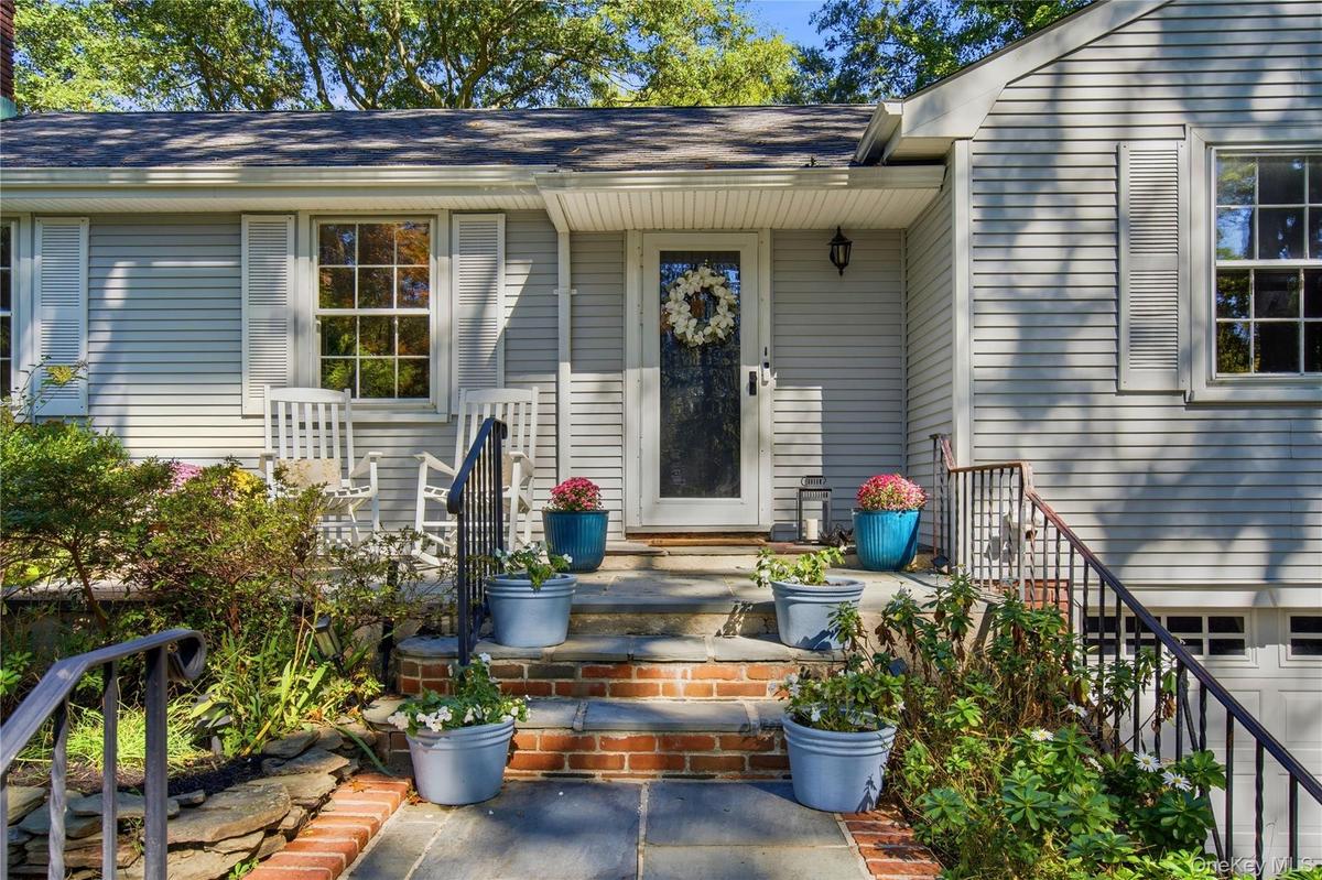 Welcoming front door , sweet area to sit outside