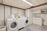large laundry room with closet and sink