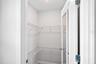 Upstairs 2nd bedroom closet virtually staged