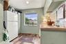 laundry room with Refrigerator