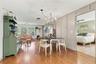Dining room from sun room, entry to primary bedroom