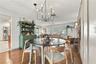Dining room looking into living space and kitchen entry