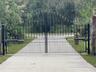 Electronic steel gate at front of 405 foot driveway.