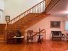 Admiring solid wood staircase and wood accents.