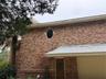 Garage, front entry door,oval window is in primary bathroom