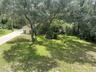 Yard, IN the distance is the well pump house and storage