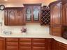 Schrock handcrafted Cherry wood cabinetry and stain glass accent panels.