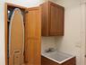 Wall cabinet for fold out ironing board, iron and built in light.