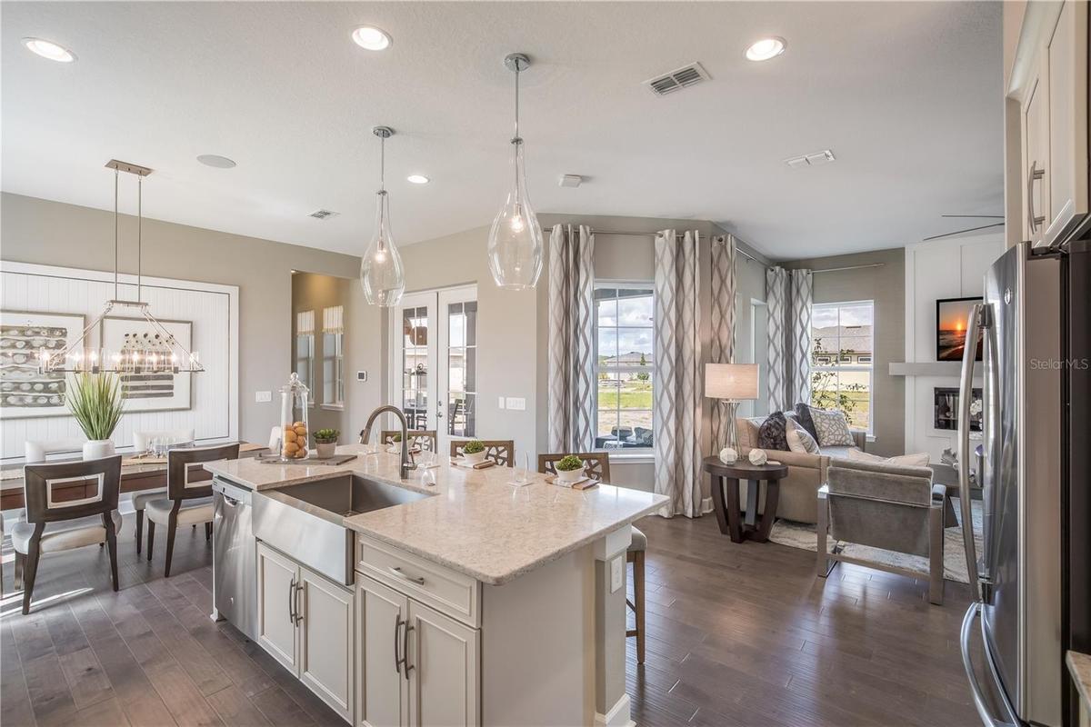 The sample photos included are of the model home and are meant to showcase the craftsmanship and design quality.