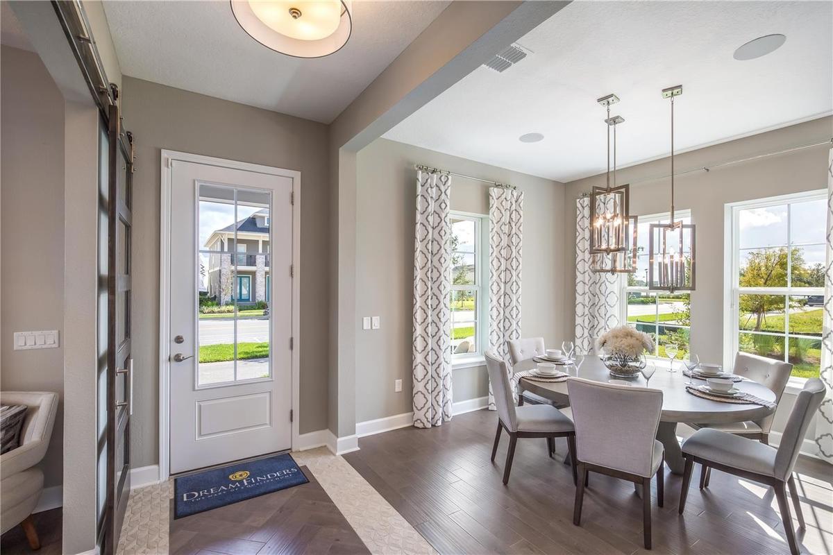 The sample photos included are of the model home and are meant to showcase the craftsmanship and design quality.