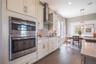 The sample photos included are of the model home and are meant to showcase the craftsmanship and design quality.