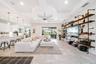 An open-concept living area with custom built-in shelving and a welcoming atmosphere.