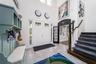 Bright and inviting foyer with impressive high ceilings