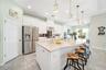 A chef-inspired kitchen with a gas range and custom finishes ideal for cooking and entertaining.