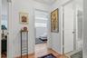 Two additional bedrooms and a shared bath are grouped together off their own hallway, creating a comfortable setup for guests or a bedroom and home of