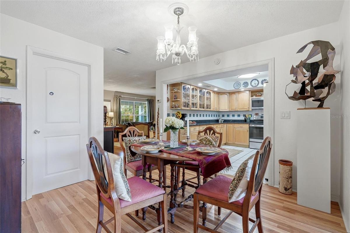 From everyday meals to special occasions, the dedicated dining area offers an inviting place to gather beside the family room.