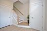 Stairs leading to second floor from entry hall.
