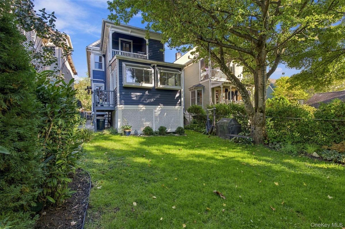 Expansive lawn area with mature trees