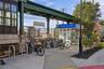 Irvington train station with platform structure, dedicated bicycle racks, and a parking pay station