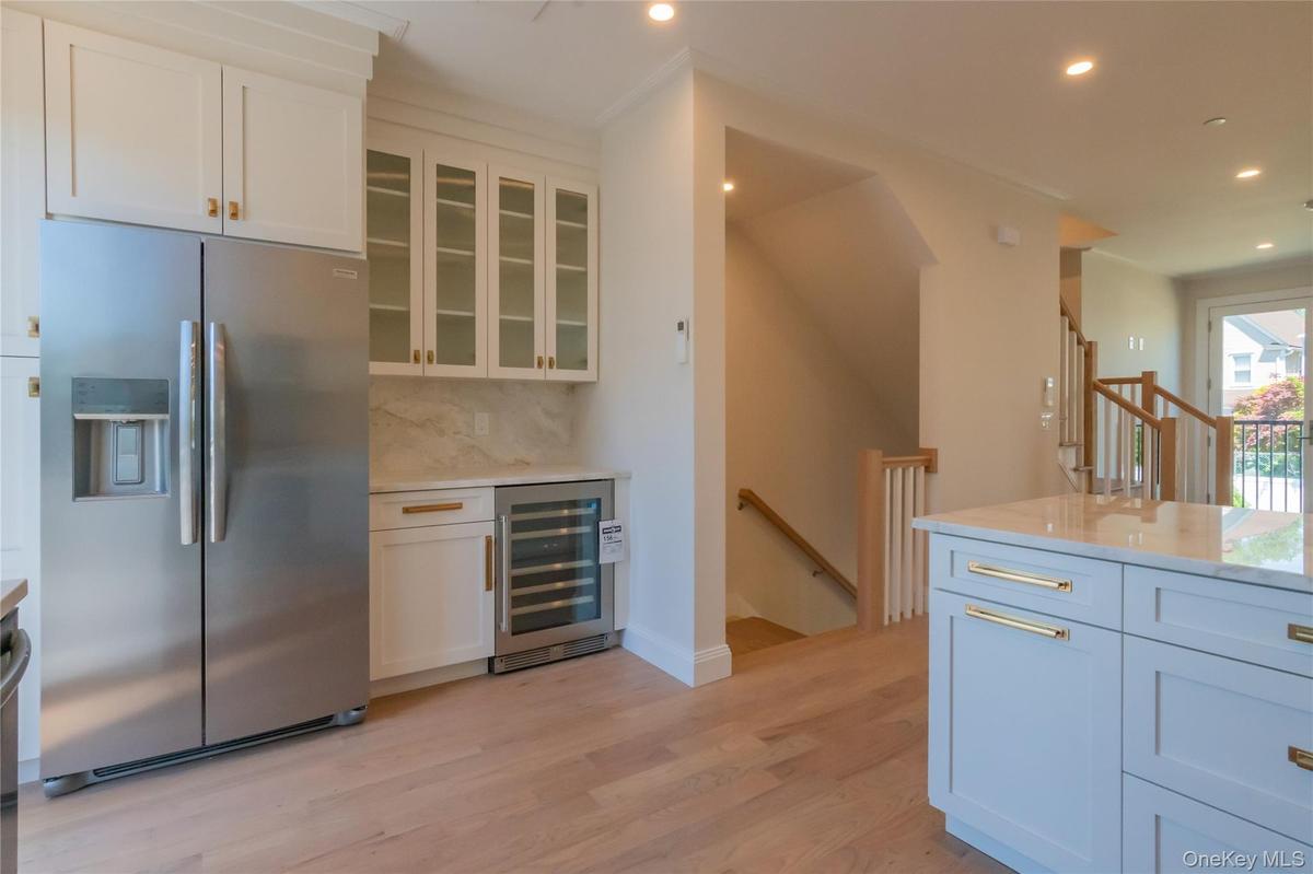 The heart of the home is a designer kitchen with quartzite countertops, & stainless-steel appliances.