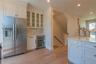 The heart of the home is a designer kitchen with quartzite countertops, & stainless-steel appliances.