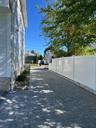 driveway with view of fence