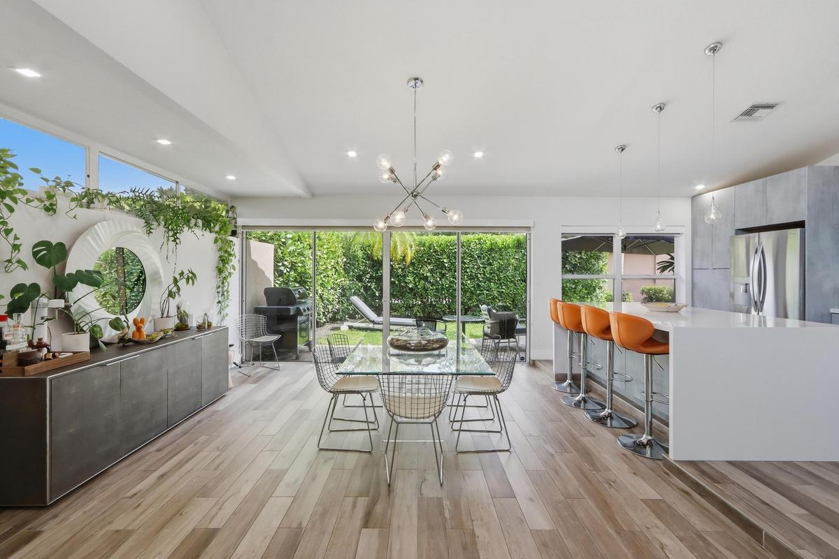 Opens to a lush, tropical garden area