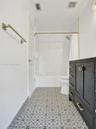 Custom Tiles in the cabana Bath & Subway tiles around the tub!