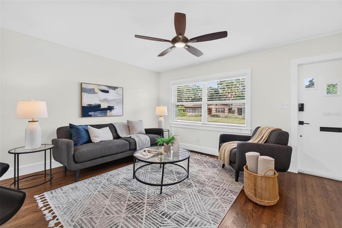 Cozy living room had cove ceilings removed & ceiling replaced.