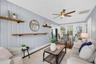 Ceiling fans throughout add comfort and style