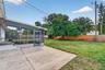 Great backyard with screened porch and additional concrete pad