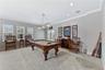 GAME ROOM W FRENCH DOORS TO BALCONY