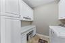 LAUNDRY ROOM LEFT SIDE CABINETS AND BUILT IN CLOSET
