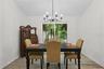 DINING ROOM VIEWS NATURE THROUGH BIG WINDOW