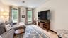 Light-toned flooring, recessed ceiling lighting, and multiple windows with outdoor views