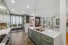 Completely redesigned in 2021. Most units do not have the sink on the island. Notice the two drawer dishwasher.