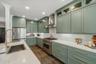 Look up at the recessed lighting and showcase glass cabinets.