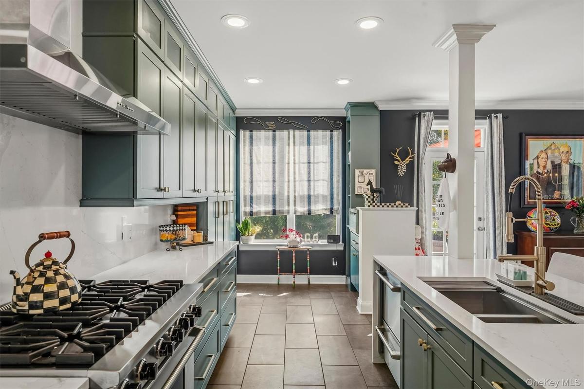 Notice the Viking stove and slate floors.