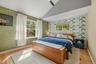 The primary suite has high angled ceilings.