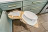 This lazy susan features a spin out pull out. No more getting on your knees to reach the back of the cabinet.