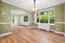 Lovely formal dining room, seamlessly connecting to living room and kitchen. Perfectly set up for easy entertaining.