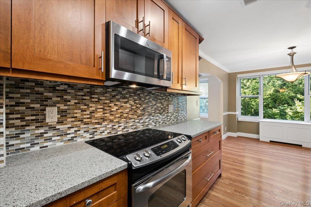 Well appointed kitchen with stainless steel appliances and granite countertops.