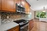 Well appointed kitchen with stainless steel appliances and granite countertops.