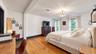 Hardwood flooring, recessed lighting, and a decorative ceiling fixture