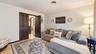 Light wood-finish flooring extending into an adjacent space