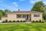 Digitally enhanced to show front of house without bushes.