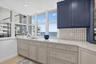 Gorgeous backsplash and countertops complete the look
