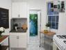 Compact kitchen featuring white cabinetry, a stainless steel sink, and a textured backsplash (virtually staged)